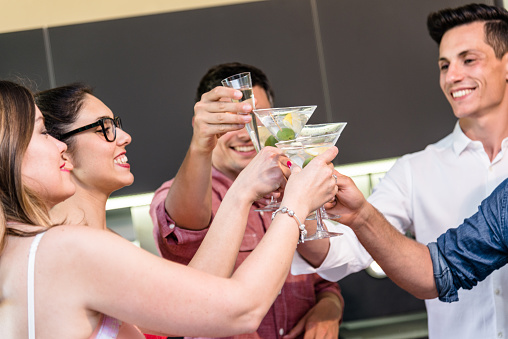 group of friends toasting with drinks