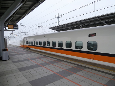 Tainan, Taiwan - March 3, 2014: Taiwan High Speed Rail (THSR/HSR) train leaves Tainan Station to Taipei.