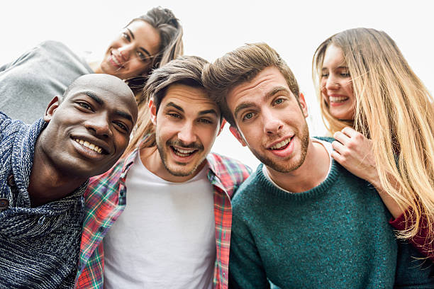istock Multiracial group of friends taking selfie 539673132