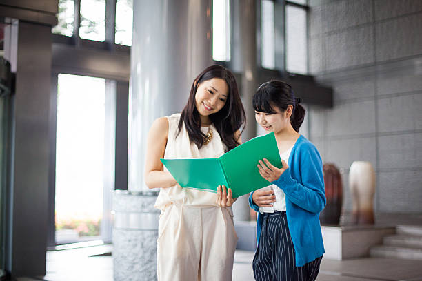 istock Female business colleagues happily work together 539673584