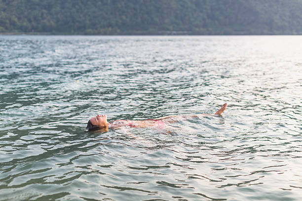 istock Woman floating in the water 539676542