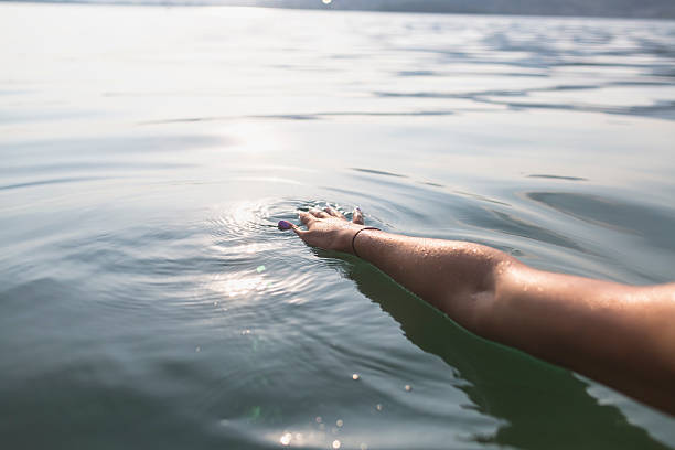 istock Female hand on the water 539676568