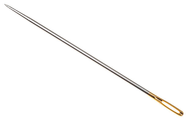 istock steel sewing needle with golden needle's eye 539678404