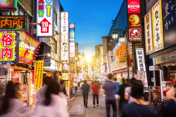 istock Shinjuku district with blurred commuters at dusk, Tokyo, Japan 539678732