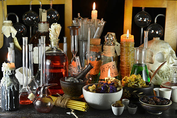 istock Mystic witch or alchemy laboratory with candles and herbs 539679086