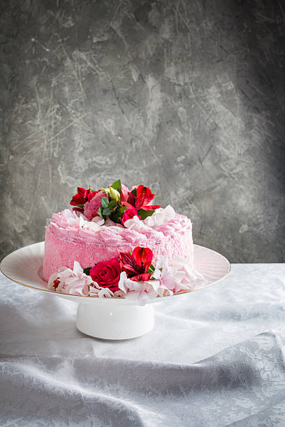 istock Pink cake with natural beautiful flowers 539679556