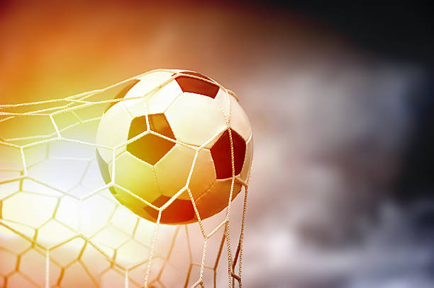istock Soccer ball in goal 539680046