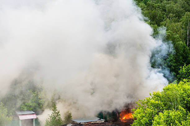 istock fire and gray smoke in urban parking area 539680958