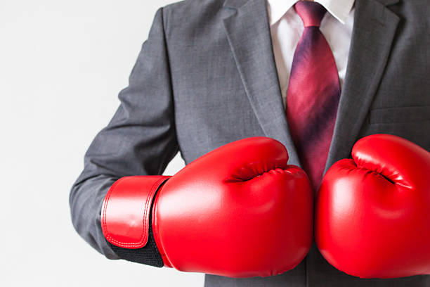 istock Businessman in boxing gloves guarding isolated 539683358