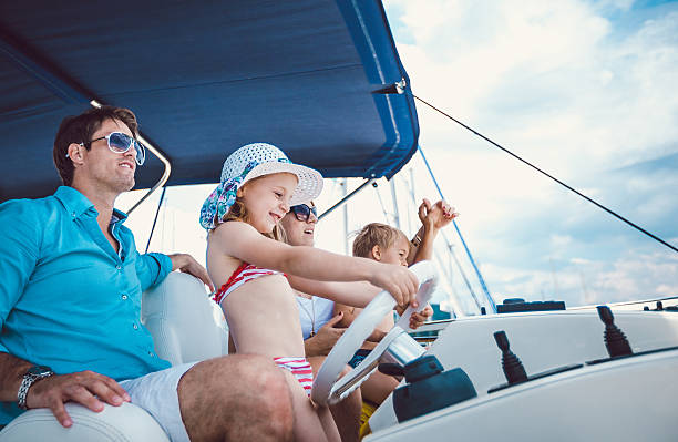 istock Family relaxing on yacht for holidays 539684664