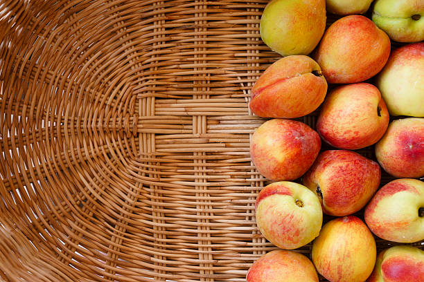 Ripe peaches in basket