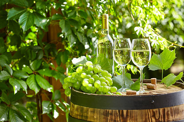 istock Glass of wine an old barrel and grape 539687098