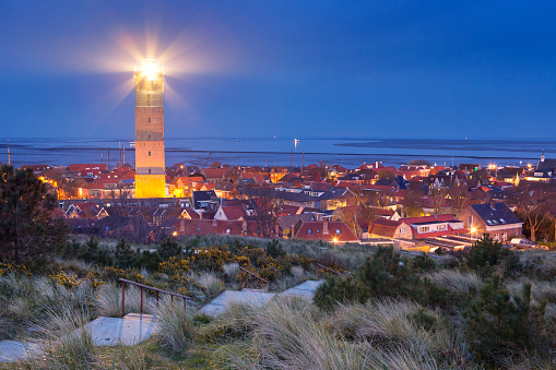 The Brandaris lighthouse in West-Terschelling on the island of Terschelling in The Netherlands at night.