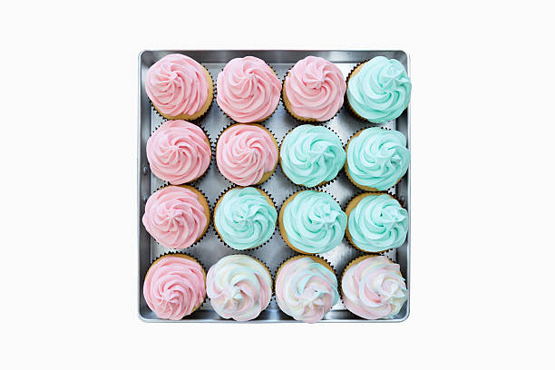 istock Cup cakes still in a tray on isolated white background. 539688096