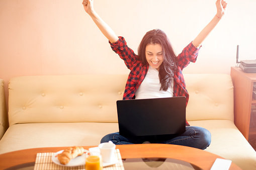 Happy woman with laptop ,excited face expression