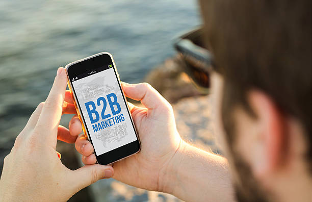 istock Man using his mobile phone  with b2b marketing on sc 539812470