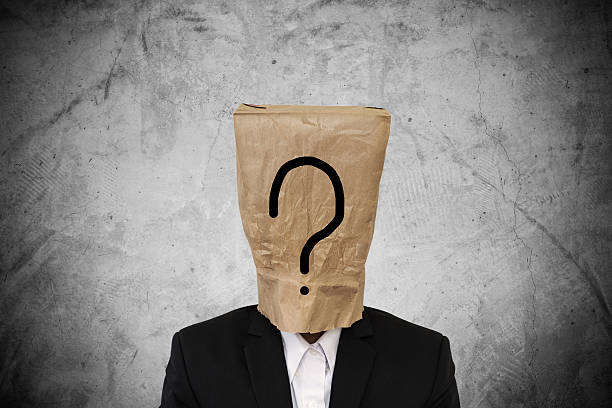 istock Businessman with brown paper bag on head, with question mark 539812922