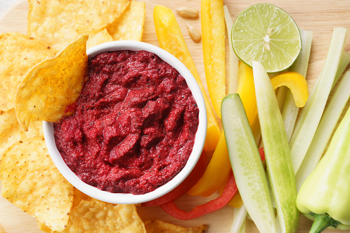 beet hummus with vegetable on white background