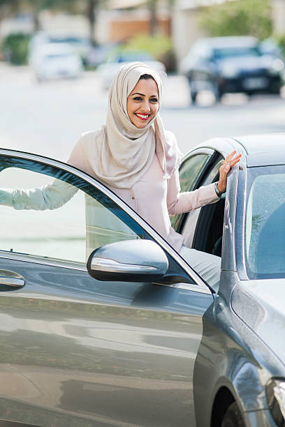 istock Middle easter woman entering a luxury car in Dubai 539813722