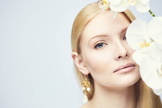 istock Young gorgeous blond with orchid 539814018