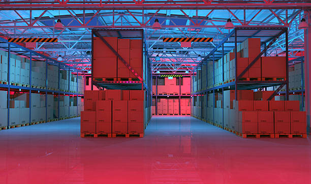 istock Warehouse full of goods and cardboard boxes illuminated at night 539816142
