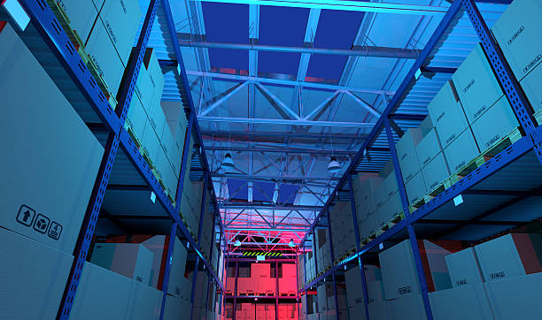 istock Dark warehouse full of goods and boxes, illuminated at night 539816324