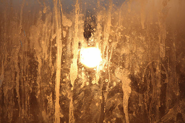 istock bulb behind dirty glass 539816456