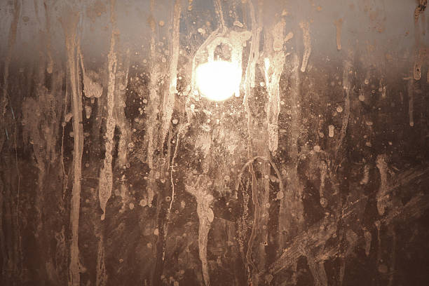 lamp behind dirty glass