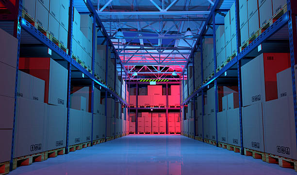 istock Warehouse aisle full of goods and boxes illuminated at night 539817100