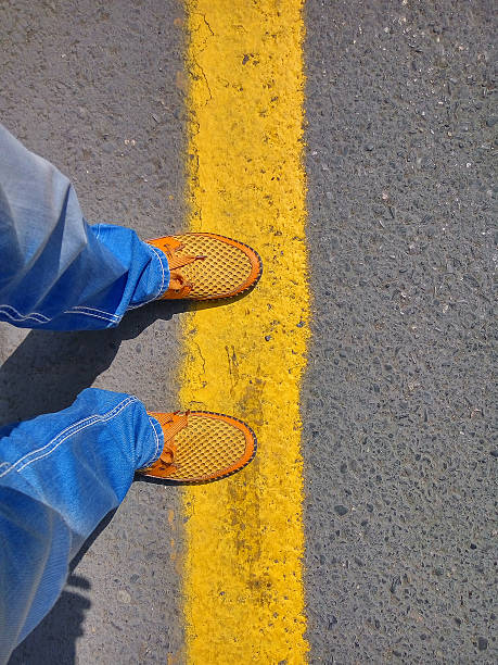 Man in jeans and a yellow shoes