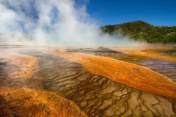 istock Colourful minerals and steam on geyser surface 539817156