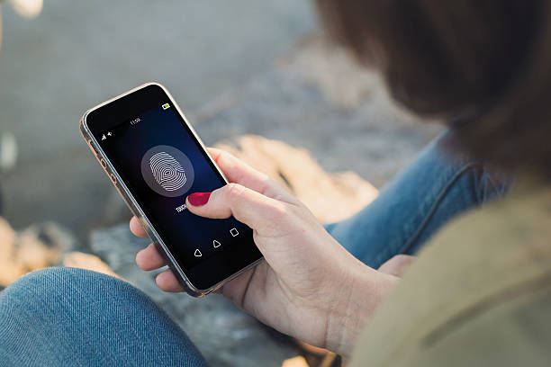 istock Woman touch the screen of her smartphone unlocking 539817876