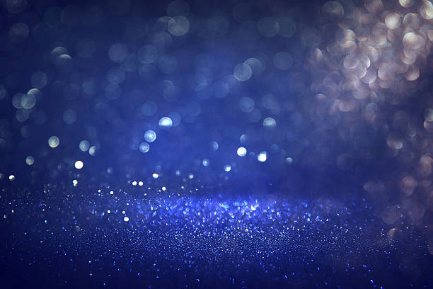 istock glitter vintage lights background. black, silver and blue 539818176