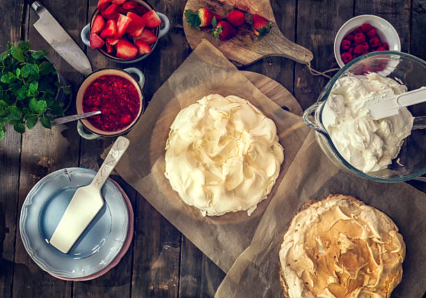 istock Preparing Berry Pavlova Cake with Strawberries and Raspberries 539818414