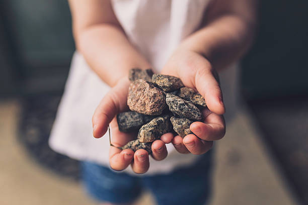 Children plays with stones