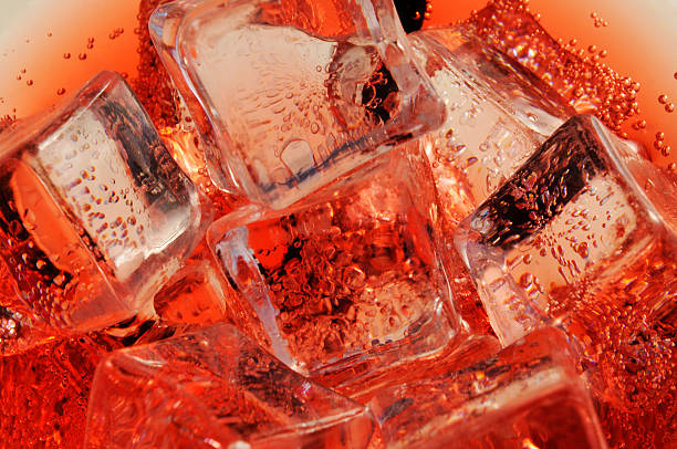 Sangria and Ice Detail of Cold Bubbly Carbonated Soft Drink with Ice red drink stock pictures, royalty-free photos & images