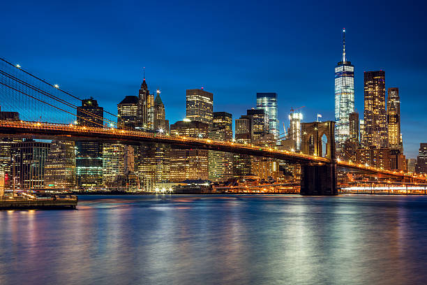 istock Manhattan with skyscrapers and  Brooklin Bridge by evening, New 539820020