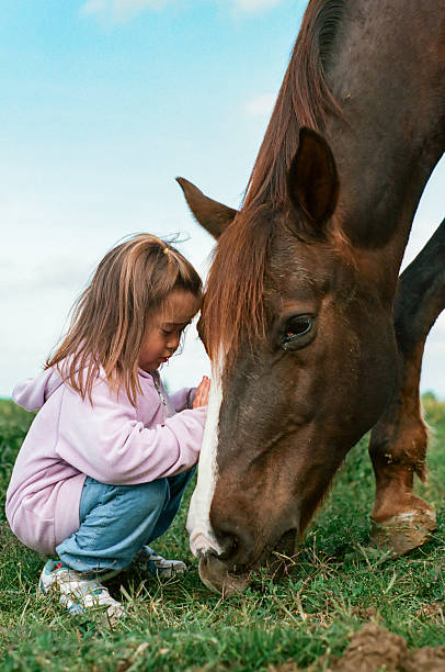 istock Girl and a horse 539820096