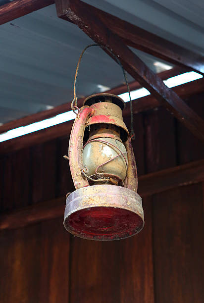 istock Old lantern (lamp) hanging on the wooden 539821166