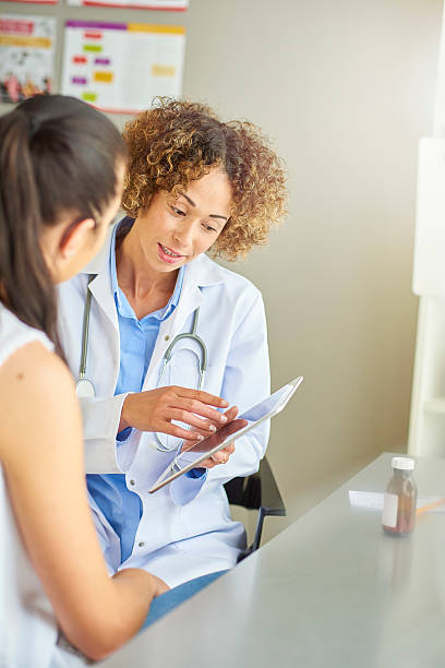 istock female doctor tablet time 539821346