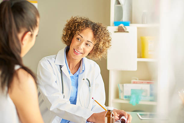 istock female nurse happily chatting to patient . 539821854