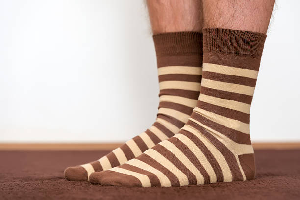 istock Wearing comfortable striped socks at home. 539822618