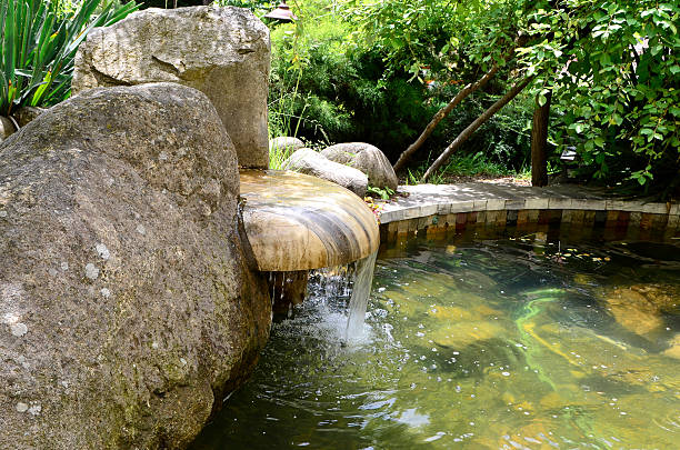 istock old stone fountain with dripping water 539823690