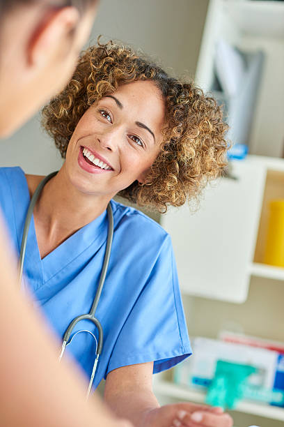 istock female nurse happily chatting to patient . 539824990