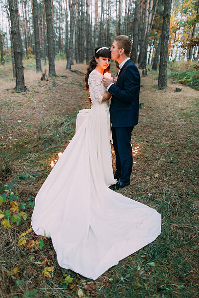 istock Happy romantic newly married couple embracing each other holding a 539825618
