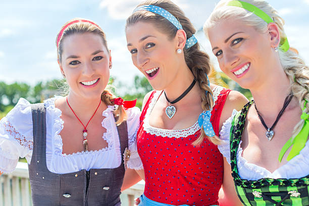 istock Friends visiting Bavarian fair having fun 539827308