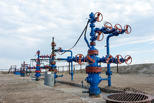 Group production wellheads and conduit with valves. Oil and gas industry.