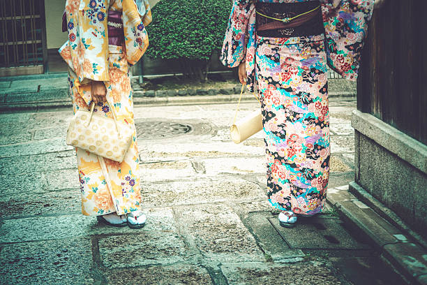Japanese Women in Kimono Wearing Tabi and Getas, Kyoto, Japan Close-up of japanese women in kimono wearing stockings tabi and geta sandals in Gion, Kyoto, Japan. No heads seen. Copy space. Nikon D800, full frame, XXXL. iStockaLypse Kyoto 2016. japan women human foot japanese culture stock pictures, royalty-free photos & images