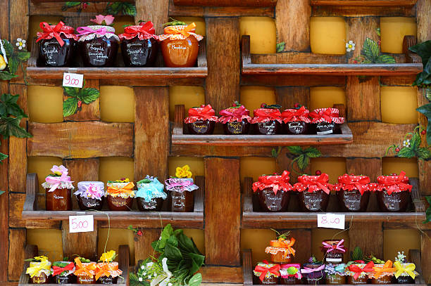 Colorful jam jars arranged for sale in Nemi, Italy