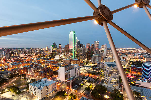 Dallas Downtown at night View over the Dallas downtown district illuminated at night. Texas, United States international landmark stock pictures, royalty-free photos & images